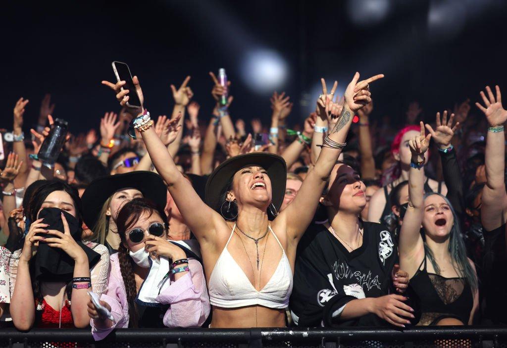 Excited fans in a crowd shot at Coachella 2024